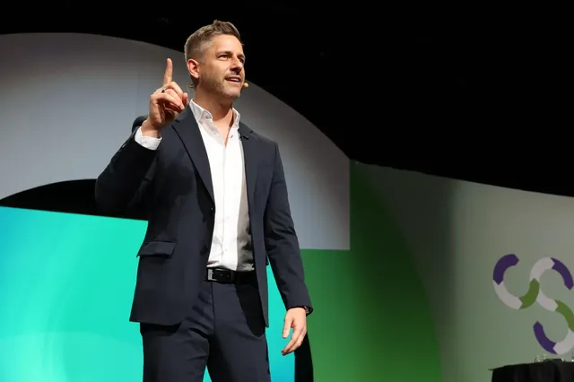Close-up of Dr. Florian Ilgen, CSP, speaking on stage as keynote speaker in Perth